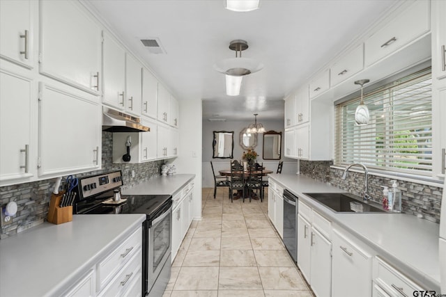 kitchen featuring under cabinet range hood, white cabinetry, stainless steel appliances, and a sink