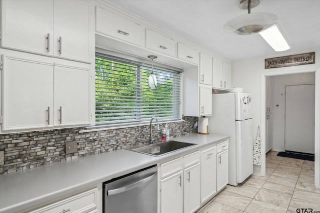 kitchen with white cabinets, stainless steel dishwasher, and a sink