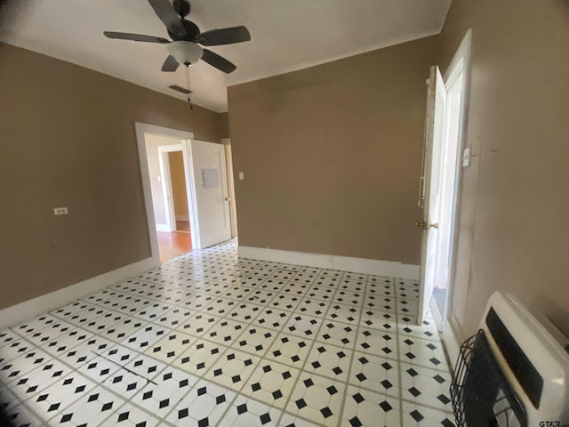 unfurnished room with crown molding, ceiling fan, and heating unit