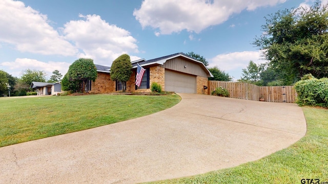 single story home with a garage and a front yard