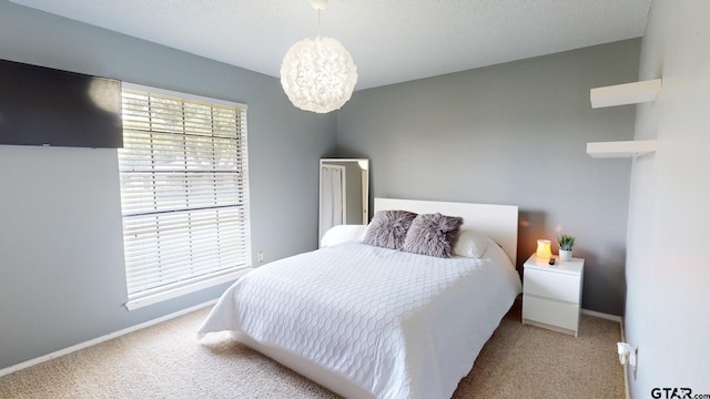 bedroom featuring light carpet