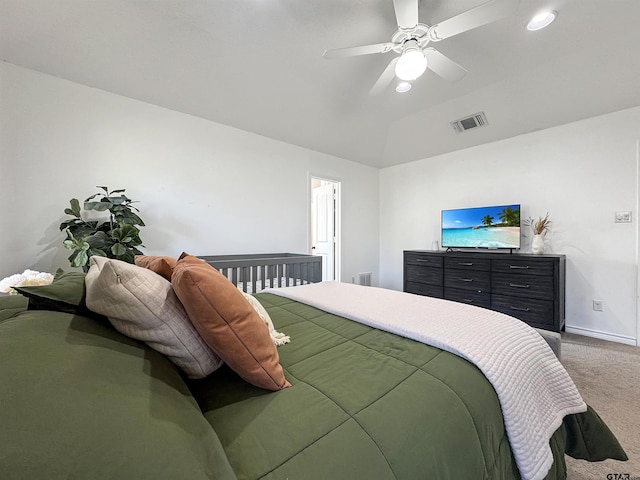 bedroom featuring vaulted ceiling, ceiling fan, carpet floors, baseboards, and visible vents