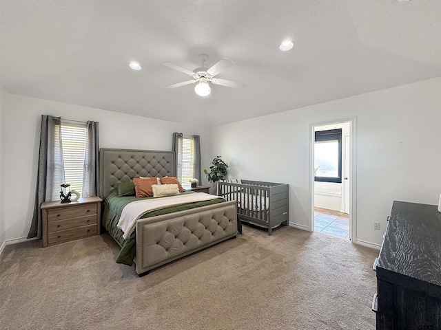 carpeted bedroom with baseboards and multiple windows