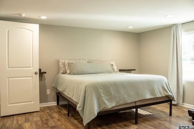 bedroom featuring recessed lighting, baseboards, and wood finished floors