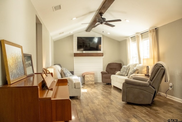 interior space with visible vents, vaulted ceiling with beams, ceiling fan, baseboards, and wood finished floors