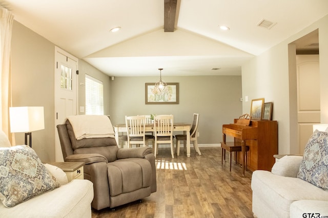 living room featuring visible vents, lofted ceiling with beams, wood finished floors, recessed lighting, and baseboards