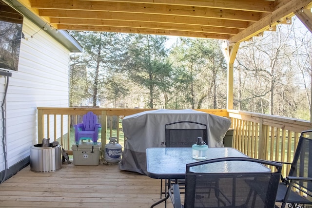 deck with outdoor dining area