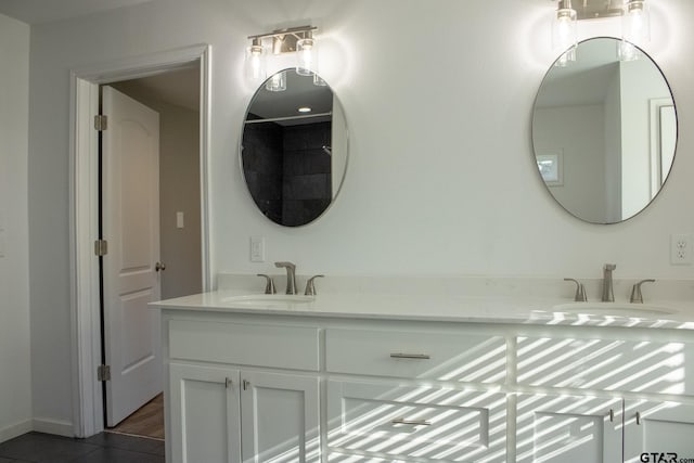 bathroom featuring double vanity and a sink