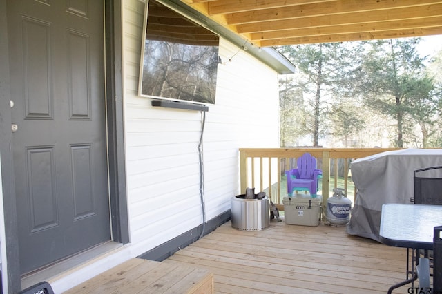 wooden deck with grilling area