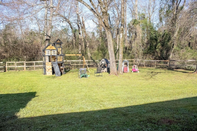 view of yard featuring a playground and a fenced backyard