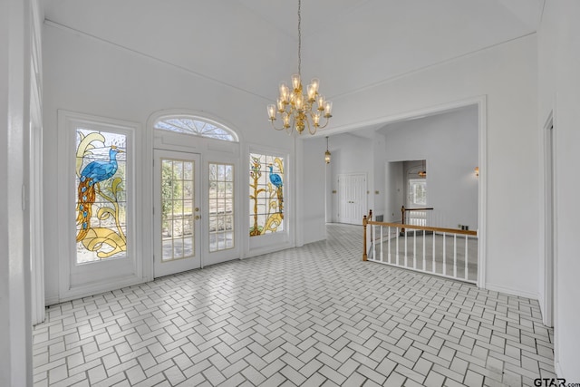 entryway with an inviting chandelier