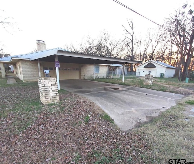 view of front of property with a carport