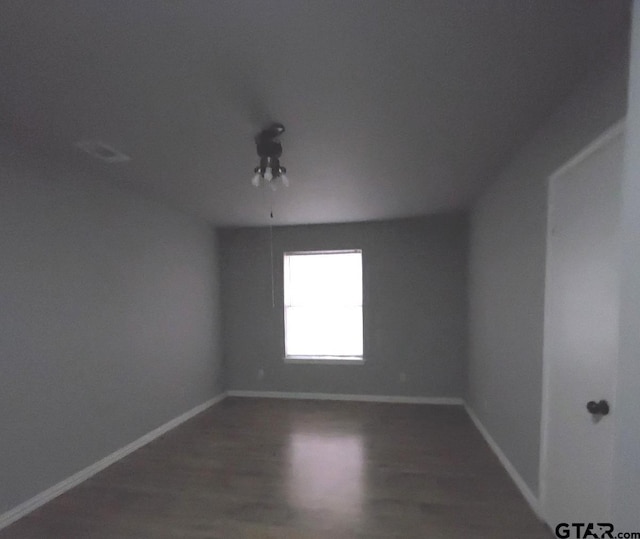 empty room featuring hardwood / wood-style flooring