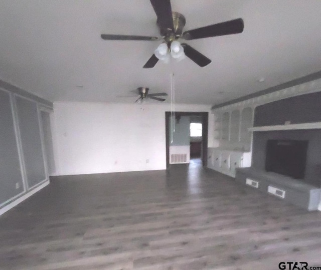 unfurnished living room with hardwood / wood-style flooring