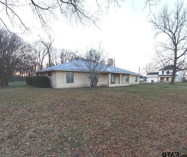 ranch-style house with a front lawn