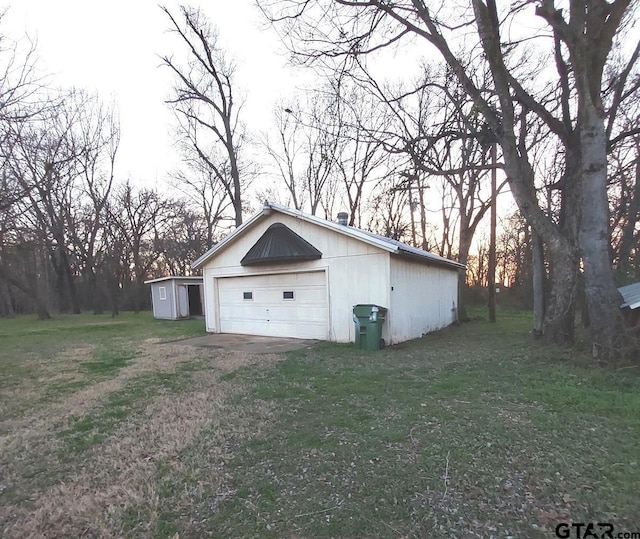 garage with a lawn