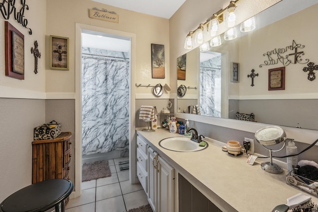 full bath featuring tile patterned flooring, vanity, and a shower with shower curtain