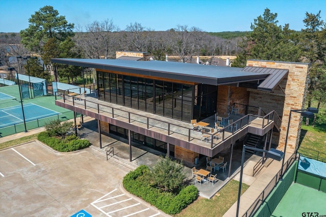 3351 Cascades Ct, Tyler, TX 75709 - exterior space with fence, a patio, and a tennis court