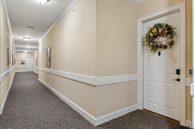 3351 Cascades Ct, Tyler, TX 75709 - hall featuring baseboards, visible vents, dark carpet, and crown molding