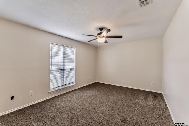 1881 Woodbridge Dr, Sulphur Springs, TX 75482 - unfurnished room with dark colored carpet, ceiling fan, and baseboards