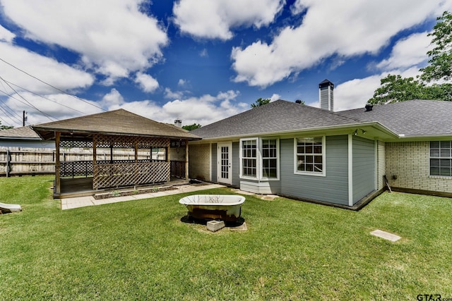 1881 Woodbridge Dr, Sulphur Springs, TX 75482 - rear view of house featuring a chimney and roof with shingles