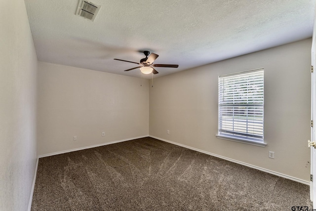 1881 Woodbridge Dr, Sulphur Springs, TX 75482 - unfurnished room featuring ceiling fan, dark carpet, a textured ceiling, and baseboards