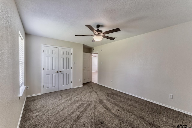 1881 Woodbridge Dr, Sulphur Springs, TX 75482 - unfurnished bedroom featuring baseboards, a textured ceiling, carpet floors, a closet, and a ceiling fan