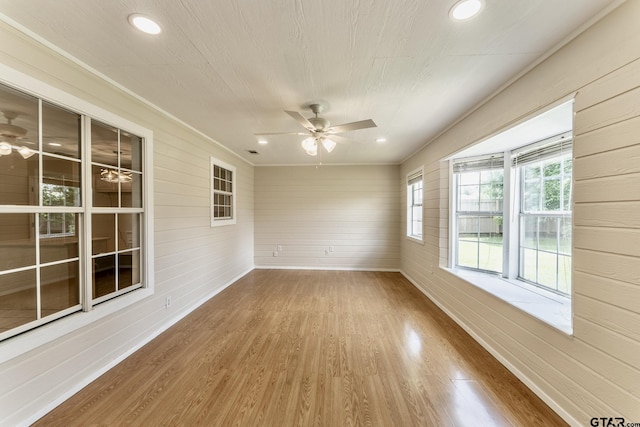 1881 Woodbridge Dr, Sulphur Springs, TX 75482 - unfurnished room featuring ceiling fan, wood finished floors, wooden walls, recessed lighting, and baseboards