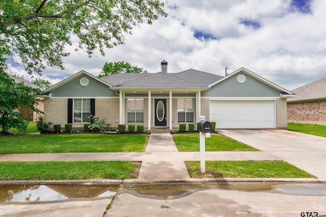 1881 Woodbridge Dr, Sulphur Springs, TX 75482 - ranch-style house with an attached garage, a front lawn, concrete driveway, brick siding, and roof with shingles
