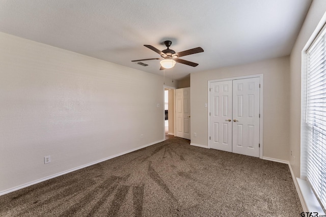 1881 Woodbridge Dr, Sulphur Springs, TX 75482 - unfurnished bedroom featuring carpet, a closet, baseboards, and ceiling fan