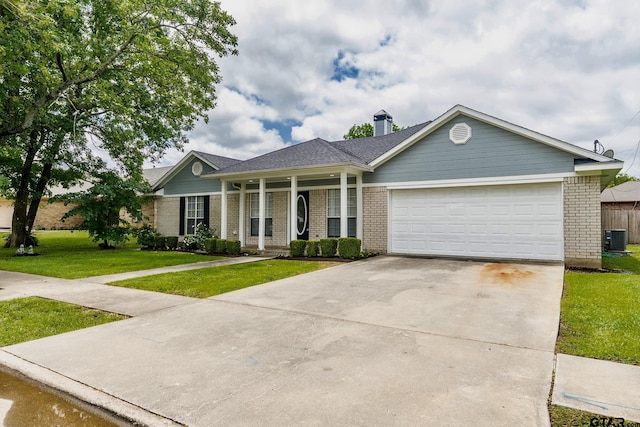 1881 Woodbridge Dr, Sulphur Springs, TX 75482 - view of front of property featuring brick siding, a front lawn, a garage, and central air condition unit