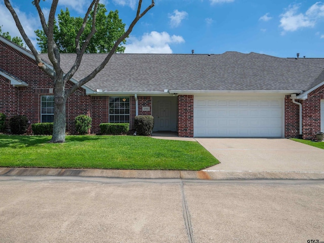 1521 Rice Rd Unit U102, Tyler, TX 75703 - view of front of house featuring a shingled roof, brick siding, an attached garage, driveway, and a front lawn