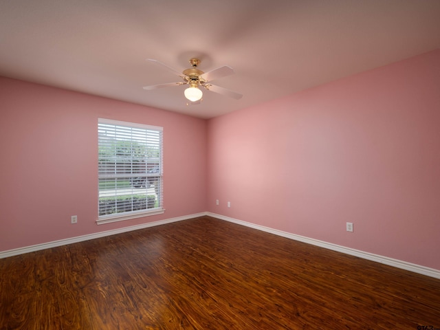 1521 Rice Rd Unit U102, Tyler, TX 75703 - empty room featuring a ceiling fan and dark wood-style floors
