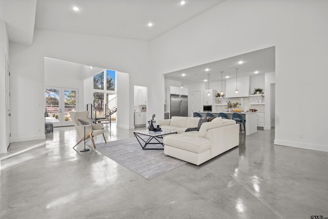 living room with a towering ceiling