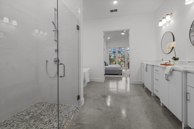 bathroom with vanity, concrete flooring, and walk in shower