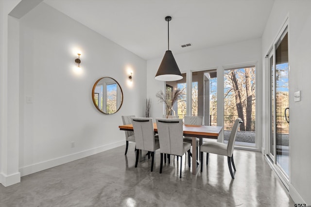 dining space with concrete flooring