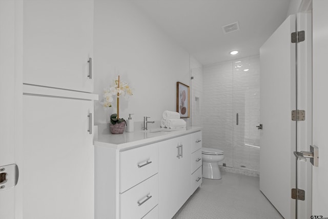 bathroom with walk in shower, tile patterned floors, vanity, and toilet