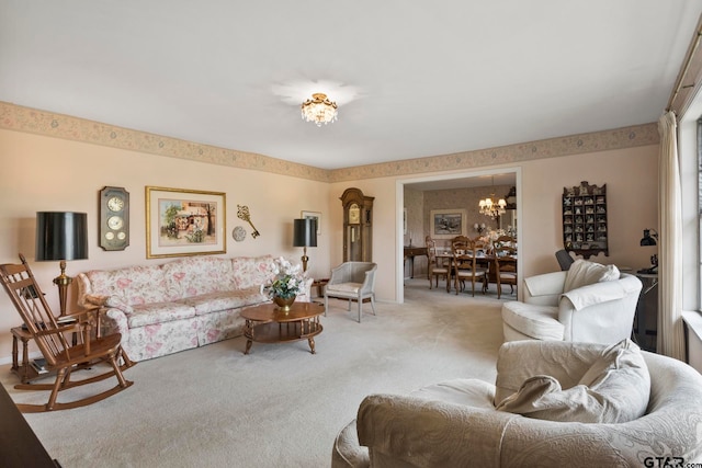 carpeted living room featuring a wealth of natural light and a chandelier