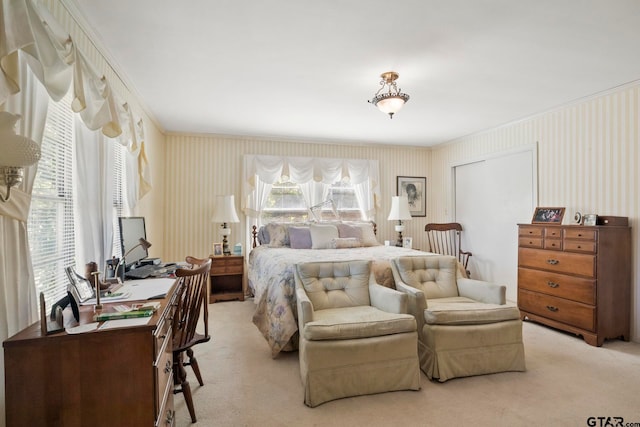 carpeted bedroom with ornamental molding