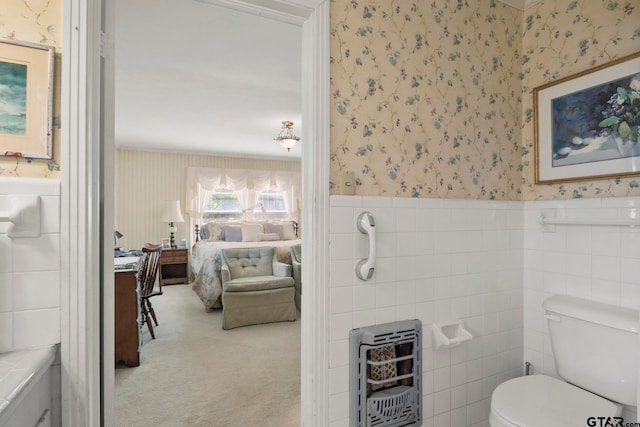 bathroom featuring tile walls, heating unit, and toilet