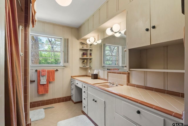 bathroom featuring plenty of natural light and vanity