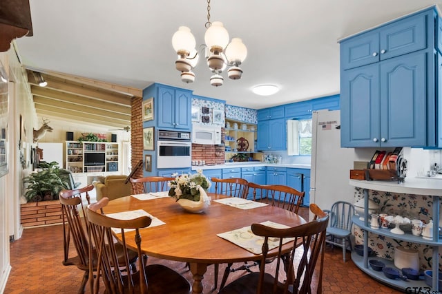 dining area featuring a notable chandelier