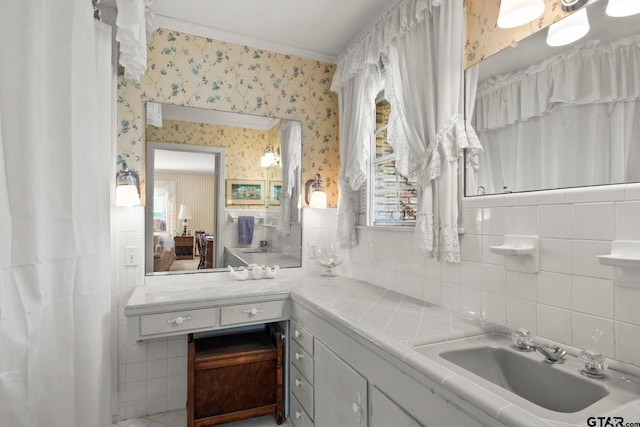 bathroom featuring tile walls, vanity, and tasteful backsplash