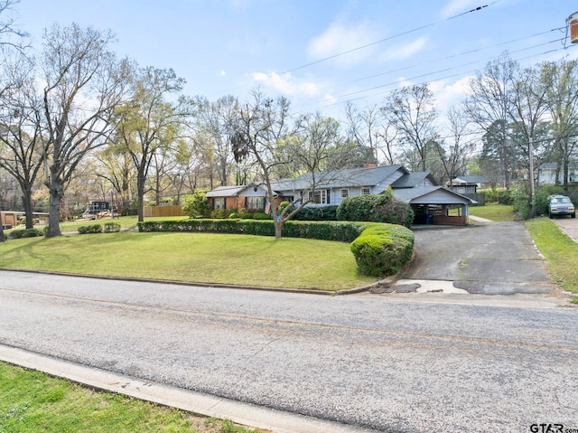 single story home with a garage and a front yard