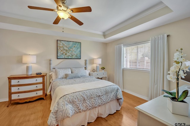 1521A101 Rice Rd, Tyler, TX 75703 - bedroom featuring crown molding, light wood-type flooring, baseboards, and a raised ceiling