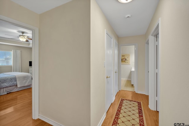 1521A101 Rice Rd, Tyler, TX 75703 - corridor featuring light wood-style floors and baseboards