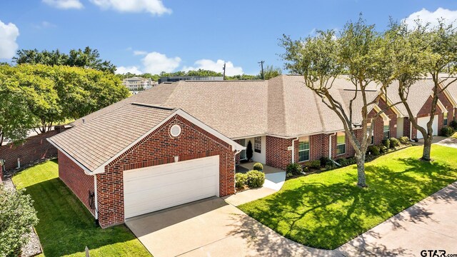 1521A101 Rice Rd, Tyler, TX 75703 - view of front of property with brick siding, concrete driveway, a front yard, and a garage