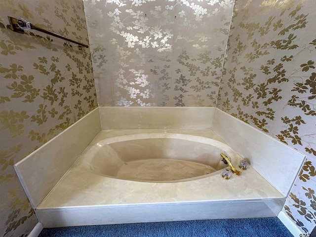 full bath with wallpapered walls and a garden tub