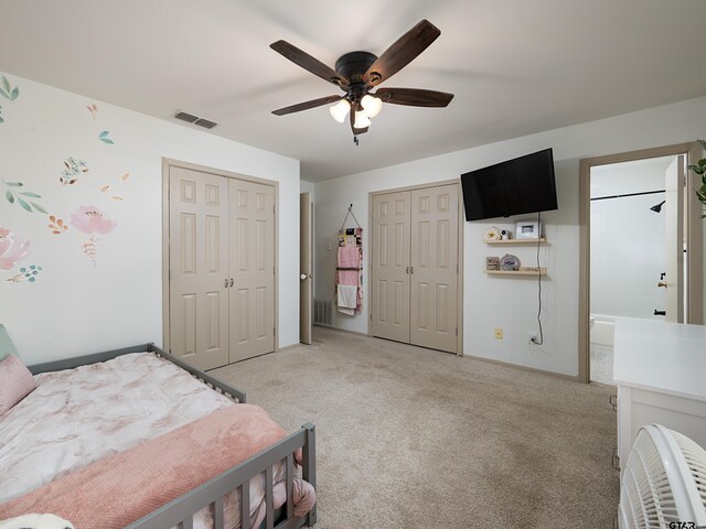 4922 Leaning Oaks Dr, Flint, TX 75762 - bedroom with multiple closets, light colored carpet, ceiling fan, and baseboards