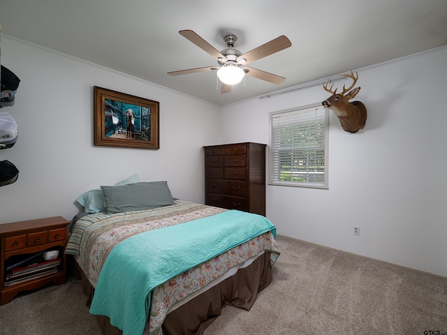 4922 Leaning Oaks Dr, Flint, TX 75762 - bedroom with carpet flooring, a ceiling fan, and ornamental molding